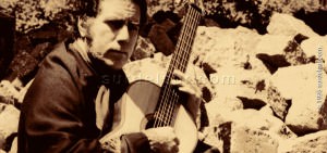 Victor Velazquez executing guitar. Victor Velazquez is guitarist, composer, poet, singer and author of argentine music