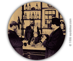 Parroquianos bebiendo junto al estaño de un Antiguo Bar 